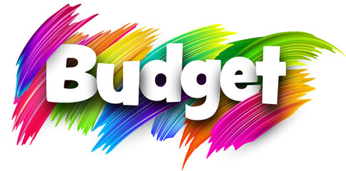 Budget paper word sign with colorful spectrum paint brush strokes over white.