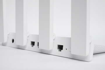 One modern Wi-Fi router on white background, closeup
