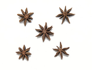star anise arranged in square shape close up isolated on a white background (spices for cooking cut out) indian cuisine (licorice flavoring seed) curry ingredient - obrazy, fototapety, plakaty