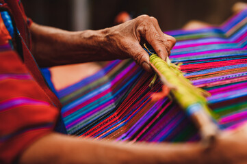 Close up shot of Guatemalan handcraft textile and colorful patterns made by indigenous woman - obrazy, fototapety, plakaty
