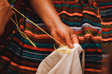 Close up shot of Guatemalan handcraft textile and colorful patterns made by indigenous woman