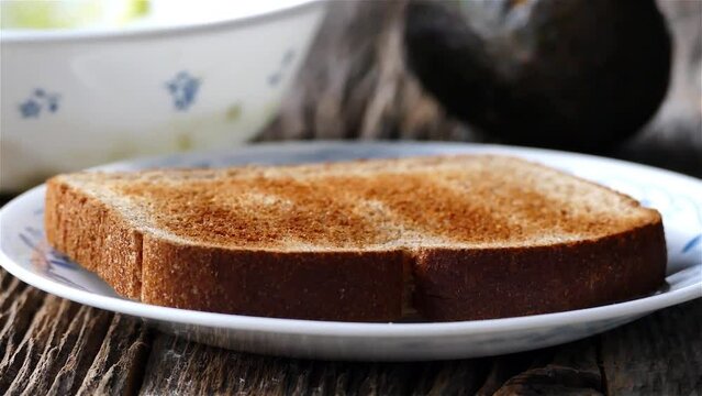 Toasted bread on plate on rustic table