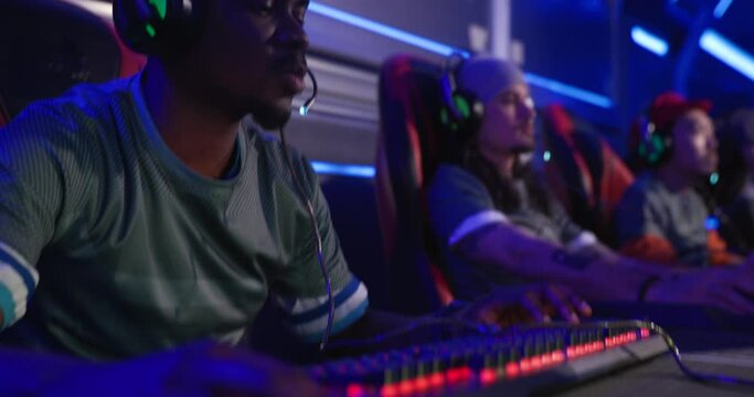 Young African American gamer playing in a esports tournament at an esports venue gaming tournament