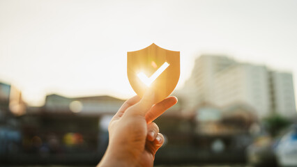 Silhouette of Businessman holding shield protect icon, Security protection and health insurance. The concept of family home, foster care, homeless support, protection, health care day.