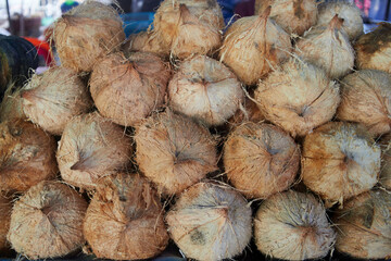 Heap of Peeled coconut for sale at market stall