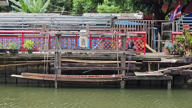 Wooden Boat on the Phasi Charoen Canal, Bangkok Thailand.