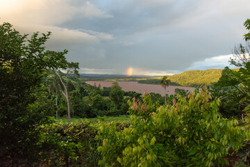 Fototapeta na wymiar sunset and rainbow over the river
