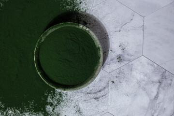 Blue-green algae Chlorella and spirulina powder in bowl. Super powder. Natural supplement of algae....