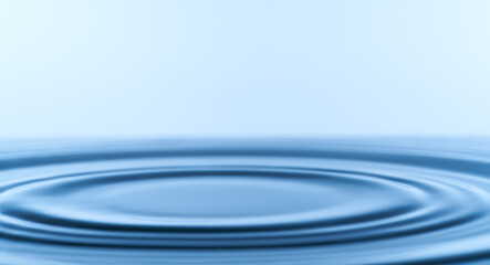 Group of water droplets fall and bounce on a water surface