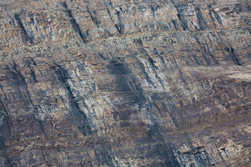 Abstract closeup of rich colors, textures and patterns of mountain rock at Banff National Park in Alberta, Canada
