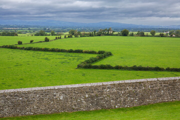 Lush, green countryside adjacent to Rock of Cashel at Cashel, County Tipperary, Ireland
