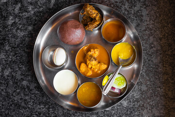 Ragi ball, Ragi mudde, Karnataka thali. Mutton and chicken curry, egg, sambar, curd