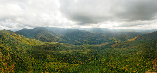 valley of a mountain river near the Goytkh farm in the mountains of the Western Caucasus (South Russia) - aerial panorama on a cloudy day in early autumn