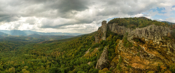 bee rocks in the mountains of the Western Caucasus near the farm Altubinal (South of Russia) - aerial panorama on a cloudy day in early autumn