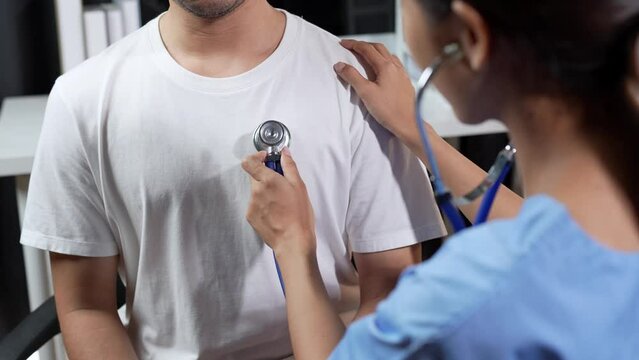 female doctor uses a stethoscope to measure the patient's heart to check for abnormalities in the body. Get a health check-up in the clinic. health care and medical concepts