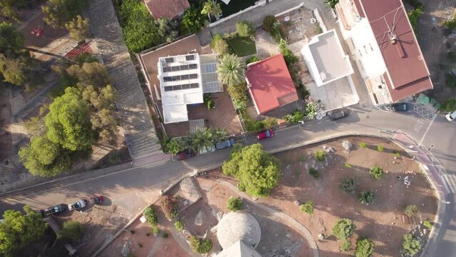 4K drone top view over the Medieval defensive stone tower in  Oropesa del Mar by the rocky coastline on the golden hour, Spain