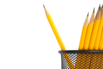 Pen holder full of pencils on isolated background