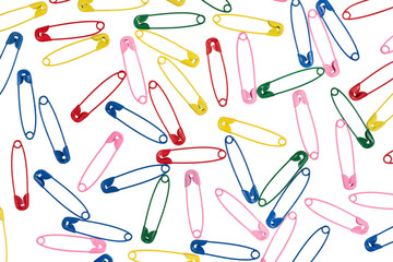 Multicolor safety pins isolated on white background. lots of colorful pins closeup