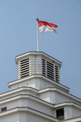Indonesian Flag, The Red and white Flag, national symbol of Indonesia, Above the Mandiri museum building