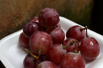 Photo of grapes that have just been picked from the garden, looking very fresh