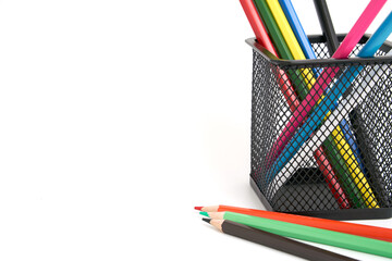 Pen holder full of colorful pencils on isolated background