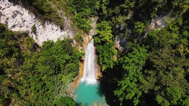 Aerial View Of Waterfall In The Midst Of Wilderness In Summer.