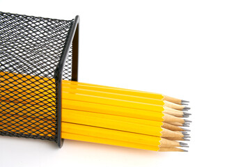 Pen holder full of pencils on isolated background