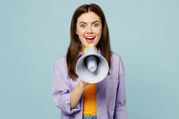 Young happy woman she wears purple shirt yellow t-shirt casual clothes hold in hand megaphone...