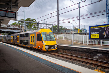 Fototapeta premium Sydney/Australia- March 20, 2019: NSW Sydney Train in action, it is the suburban passenger rail network serving the city of Sydney, New South Wales, Australia