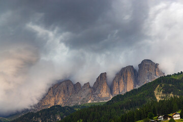 Fototapeta premium A view of the Sassolungo and the countryside into Val di Fassa