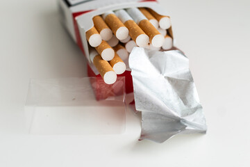 Cigarettes in the cigarette box over white background