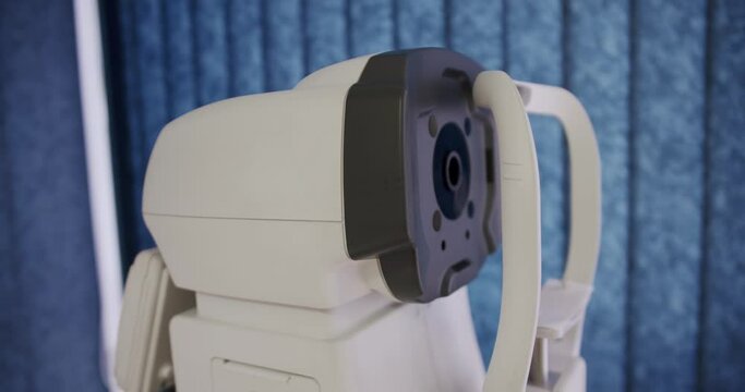 Modern refractometer at ophthalmologist cabinet in hospital. Ophthalmology diagnostic equipment for eye test. Ophthalmic professional apparatus for examination eyesight.