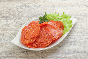 Sliced pepperoni sausage in the bowl