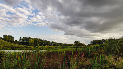 Fototapeta premium clouds over the river