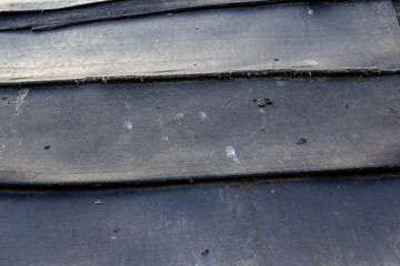 background sheets of black thick dirty rubber are laid in layers