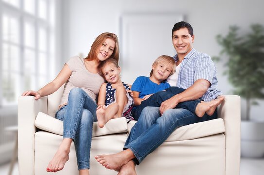 Joyful happy young family with kids sitting at home, AI generated image