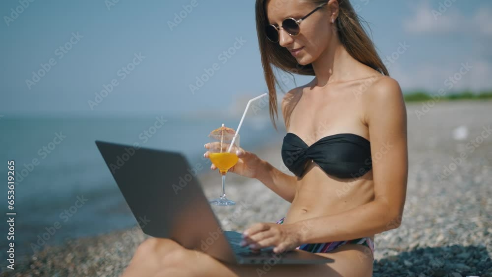 Poster a female freelancer is working on laptop near sea. programmer is coding and surfing on notebook. rem