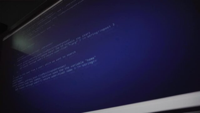 Programming code running down on computer screen
