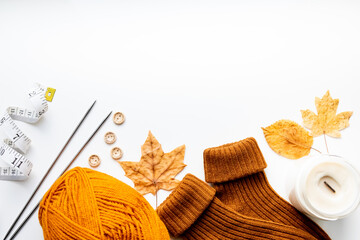 Set for knitting children's socks. Orange threads, knitting needles, buttons, centimeter.