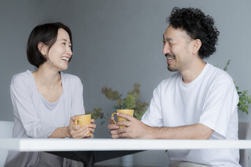 Couples and married couples having a conversation A happy morning at home staring at each other