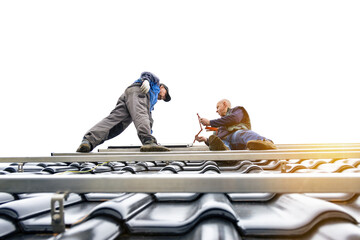 Technicians standing on the solar panel mounting rack on the roof of a house - obrazy, fototapety, plakaty