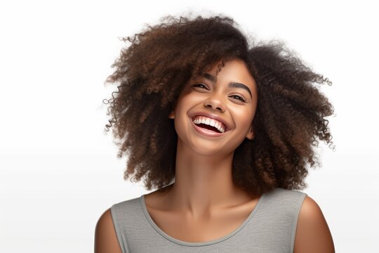 Beautiful smiling african american girl with an afro hairstyle isolated on white background.