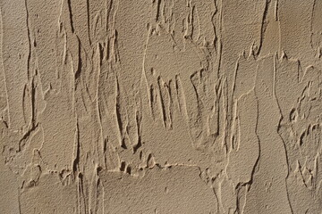 Macro of beige wall with English stucco finish