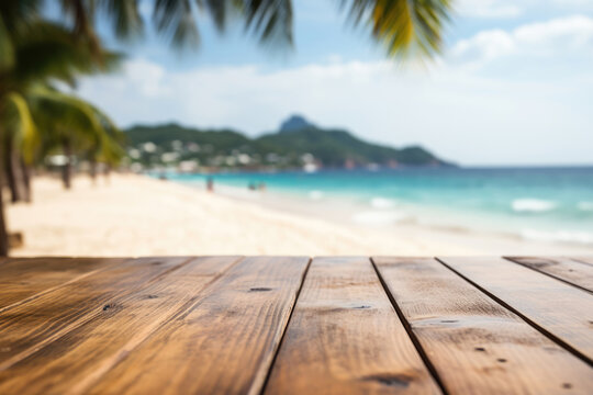 Empty wooden table with blur tropical beach on background. Copyspace for text