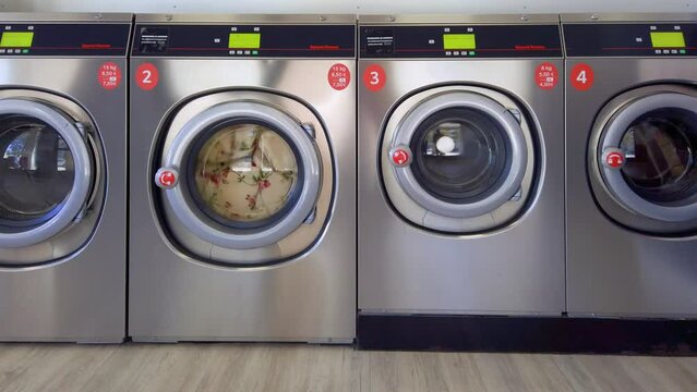 Washing machines in operation at self-service laundry