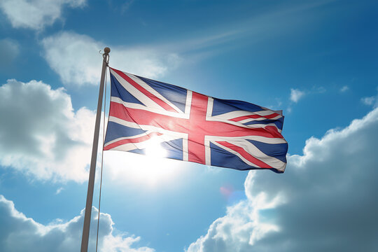 England flag flying on the blue sky