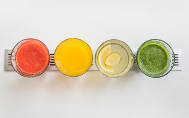 Top view of various freshly homemade fruit smoothies and juices in a café restaurant
