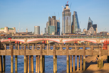 Pier with London cityscape in England