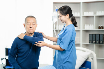 senior man doing exercise at clinic with physiotherapist. help of a personal trainer during a rehabilitation session.