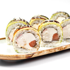 asian food - sushi roll with eel on plate on white background.